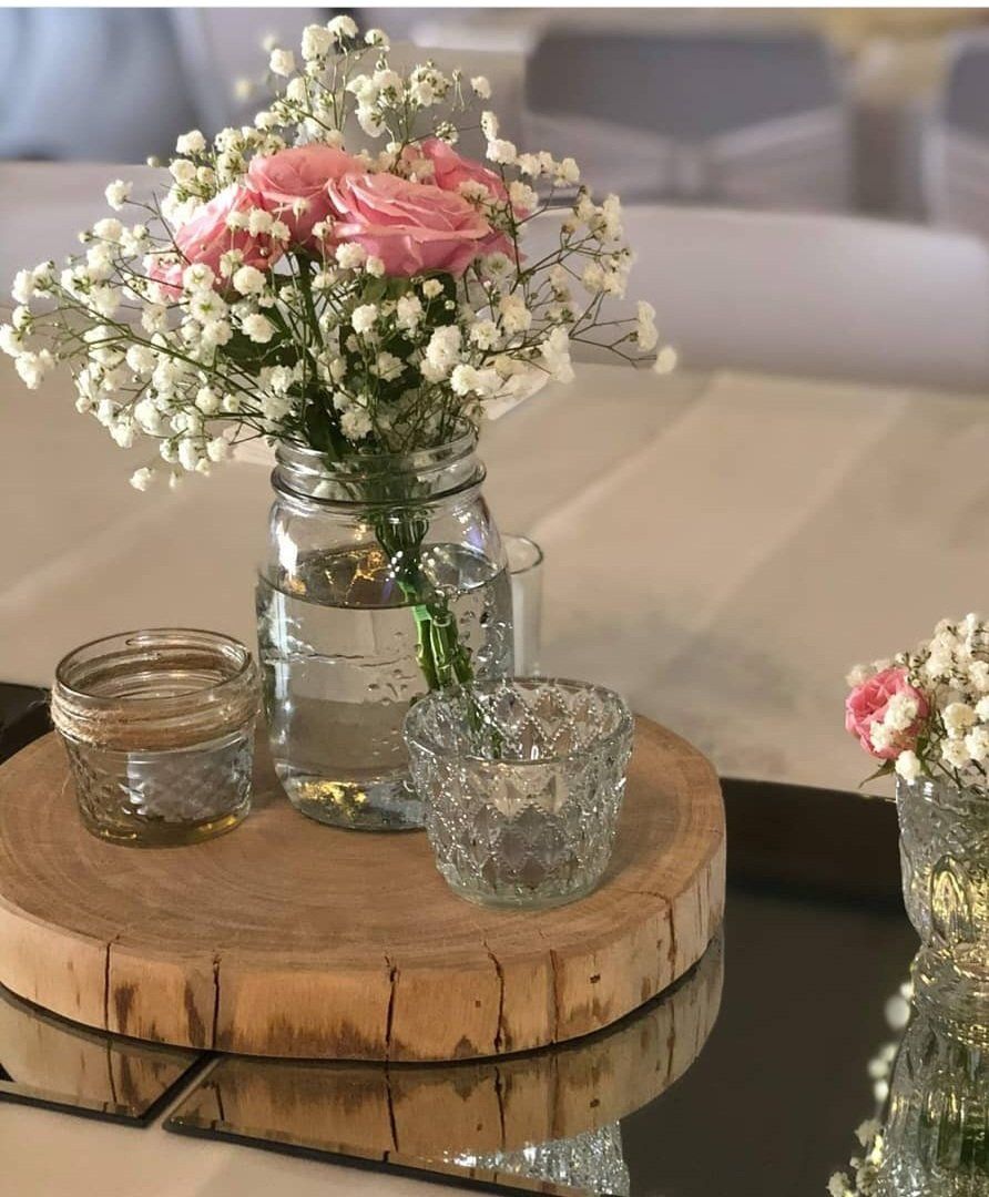 A Wooden Tray with Flowers and Candles on It — CK's Milling & Earthworks in Bells Bridge, QLD