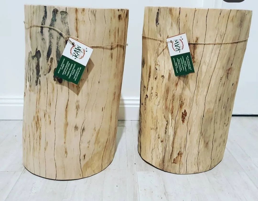 Two Wooden Stools Are Sitting Next to Each Other on A White Floor — CK's Milling & Earthworks in Bells Bridge, QLD