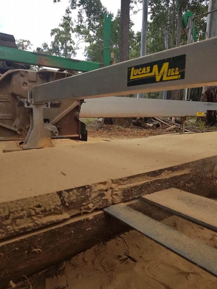 A Lucas Mill Machine Is Cutting a Piece of Wood — CK's Milling & Earthworks in Kilkivan, QLD