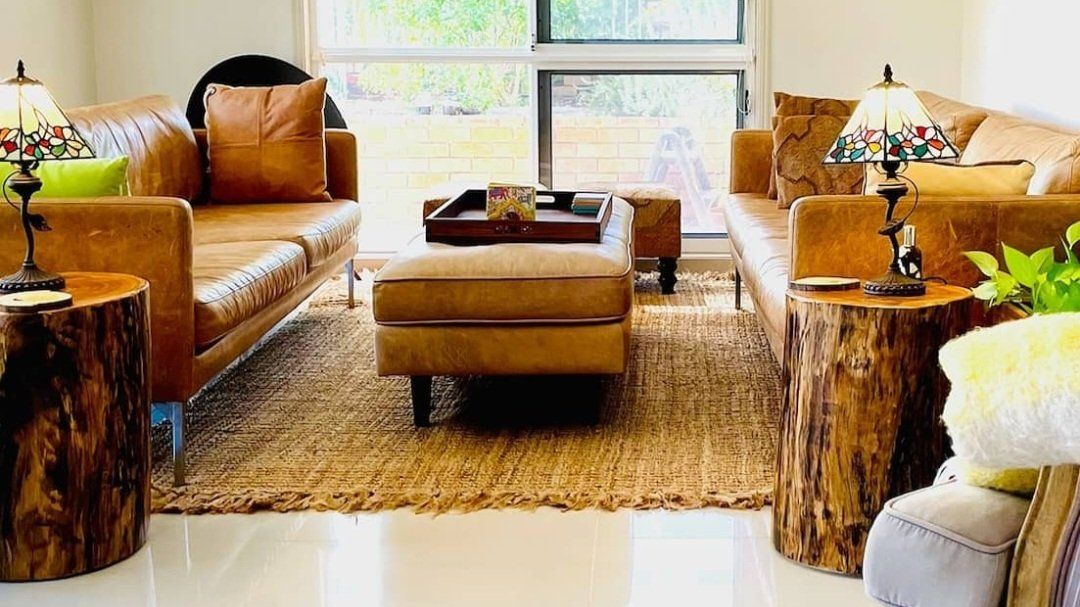 A Living Room Filled with Furniture and Stump End Tables — CK's Milling & Earthworks in Bells Bridge, QLD