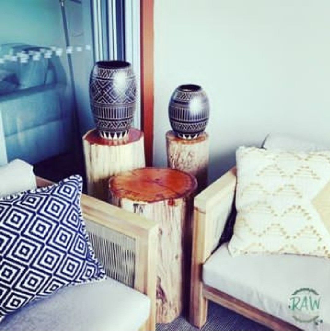 A Room with A Chair and Two Vases with The Word Raw on The Bottom — CK's Milling & Earthworks in Bells Bridge, QLD