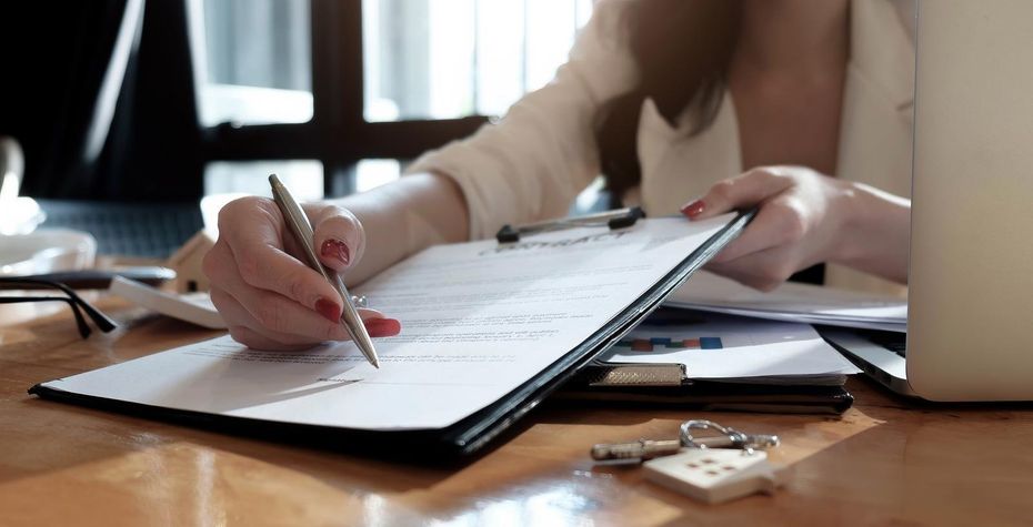 office worker holding a pen