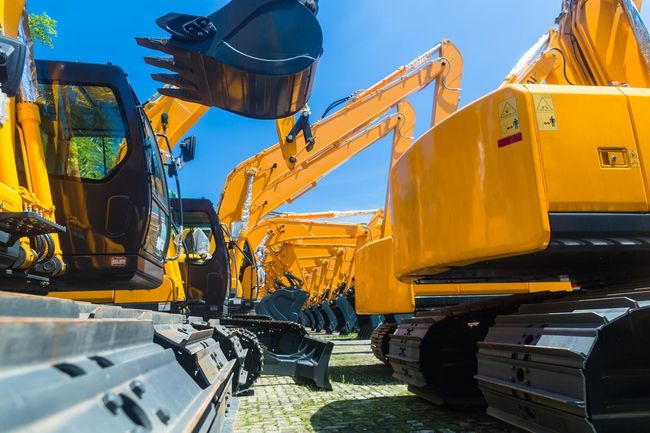 excavators parked in the parking lot