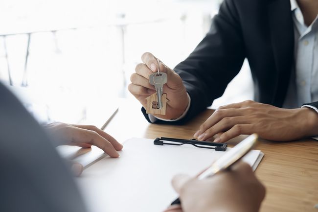 worker holding a key