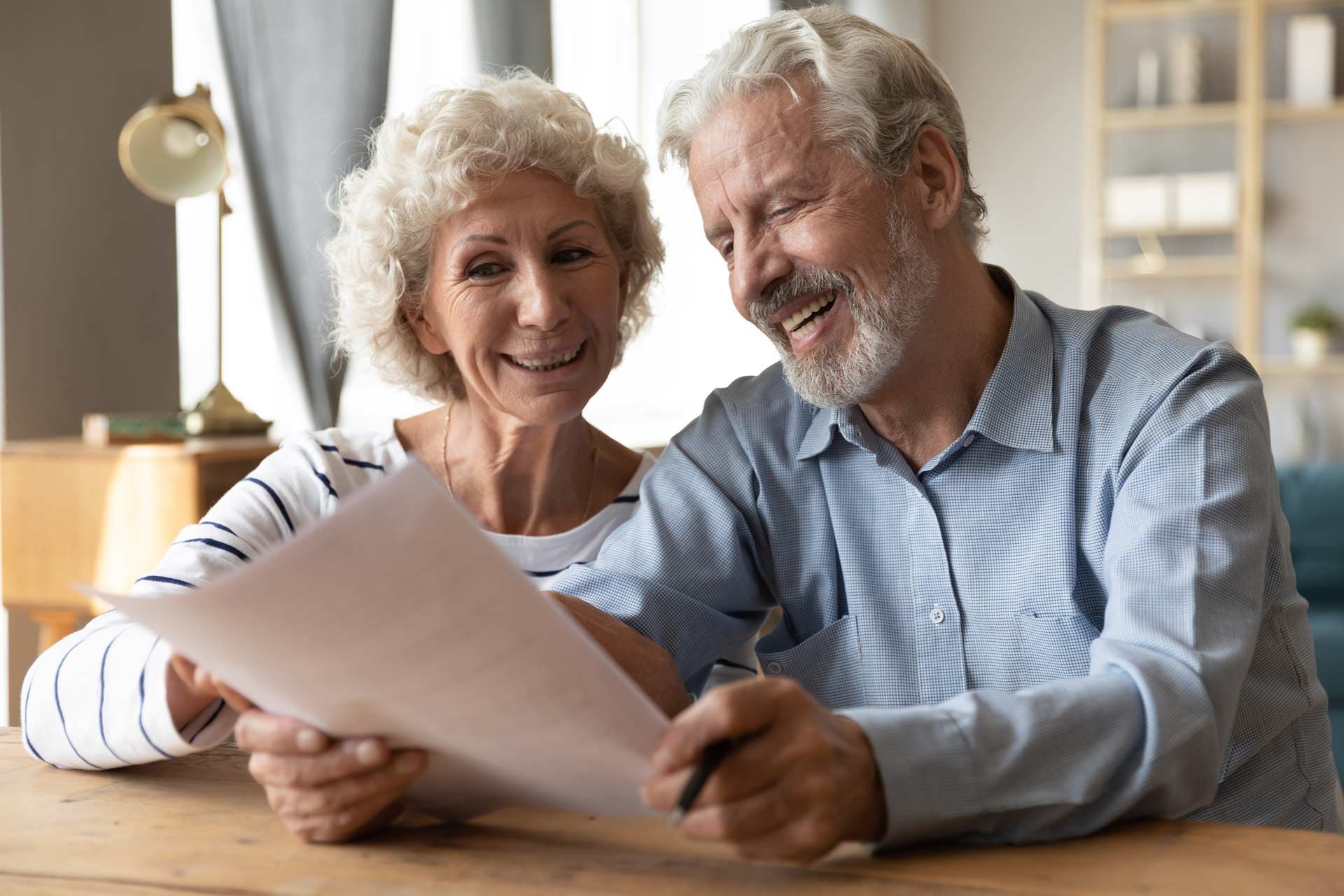 Happy Senior Couple Checking Their Life Insurance