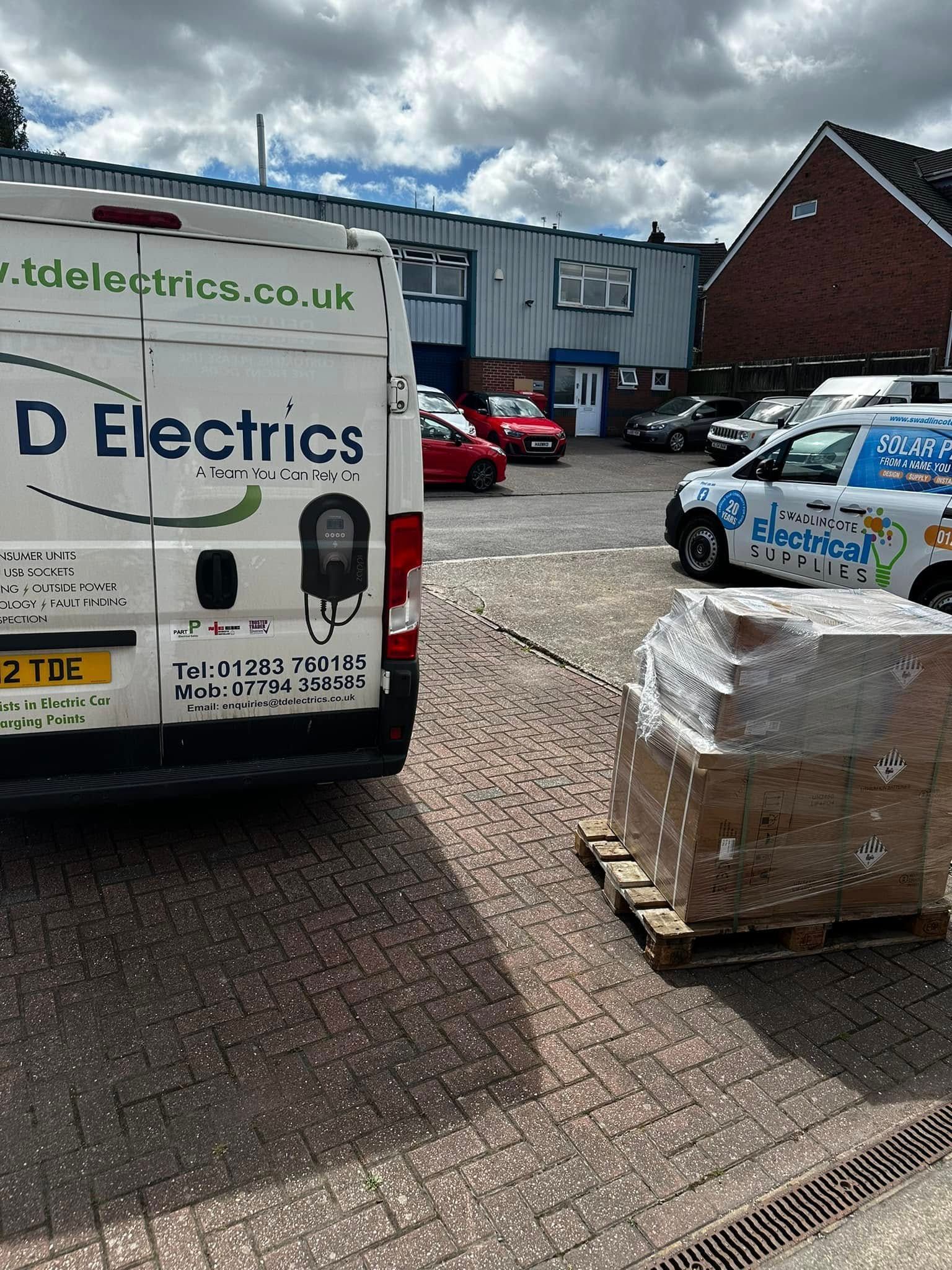 Two company vans, one labeled 