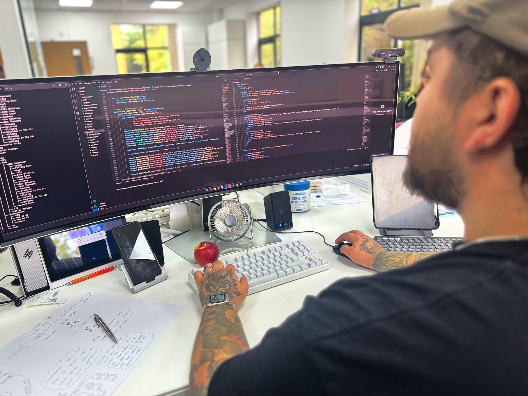Man at desk with computer, searching 