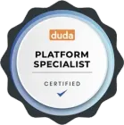Duda Platform Specialist circular badge featuring the Duda logo, white text, and a blue checkmark on a scalloped background.