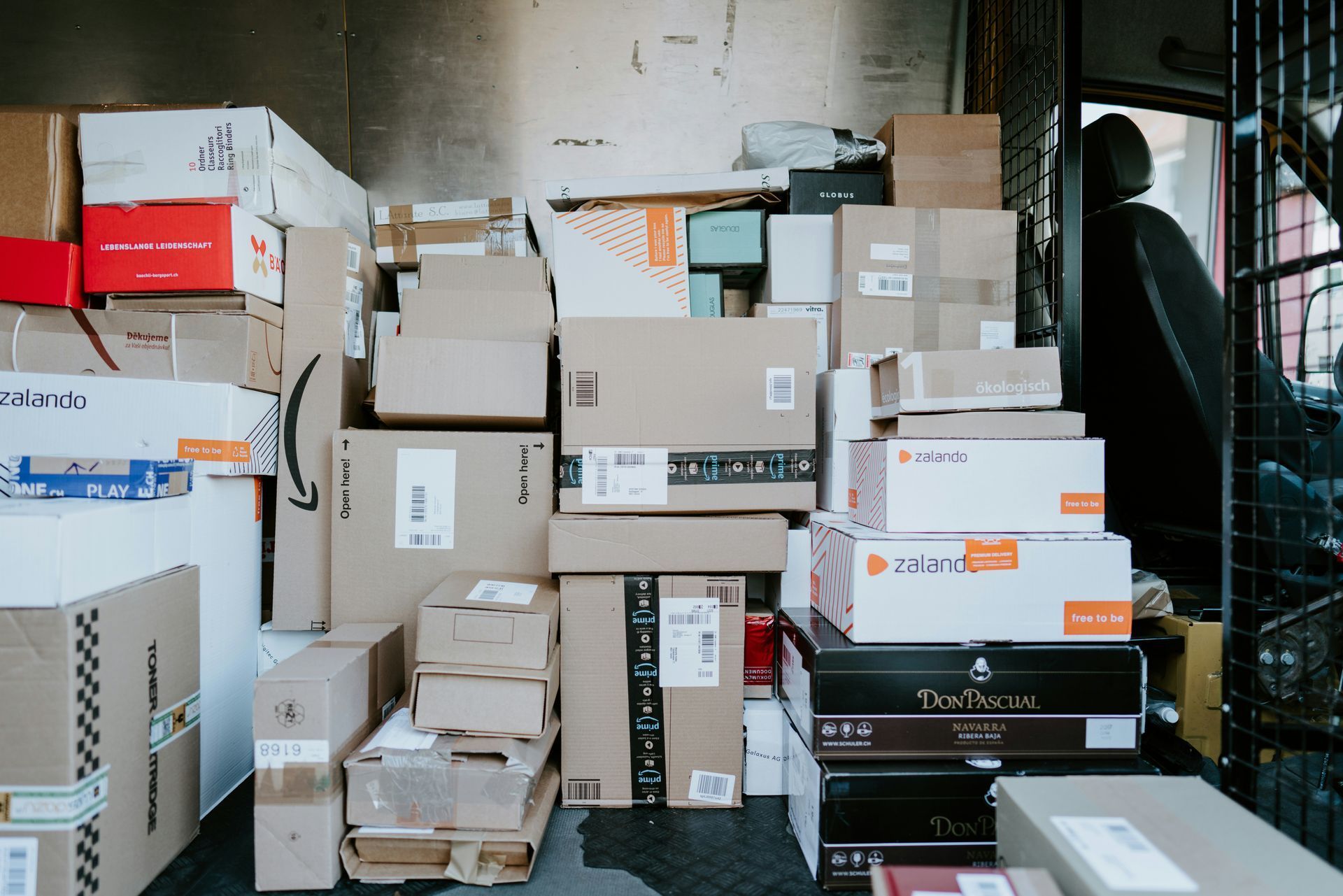 Looking into the back of a van full of boxes ready for delivery