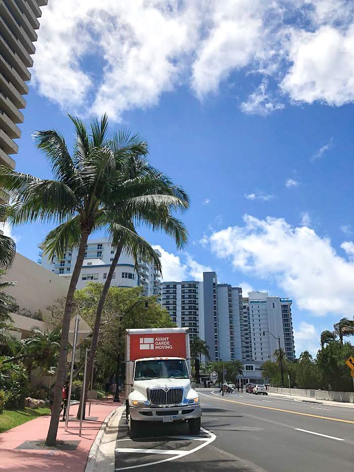 a moving truck stationed in a residential area