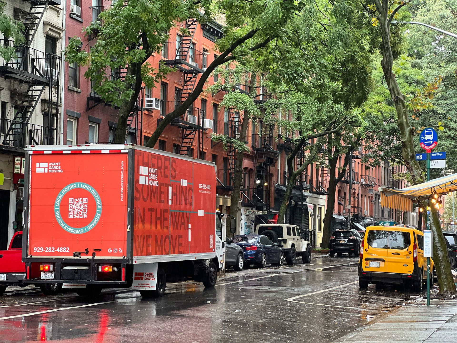 photo of avant-garde truck parked in front of customers apartment in East Village, Manhattan