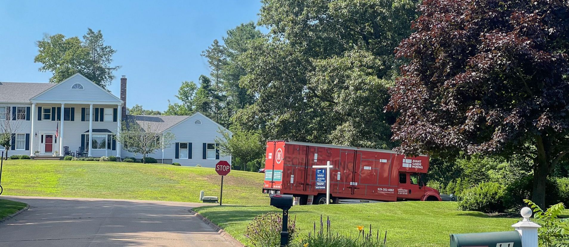 Photo of Avant-Gadre moving truck in front of the customers house in Connecticut, during a residential relocation from NYC to CT