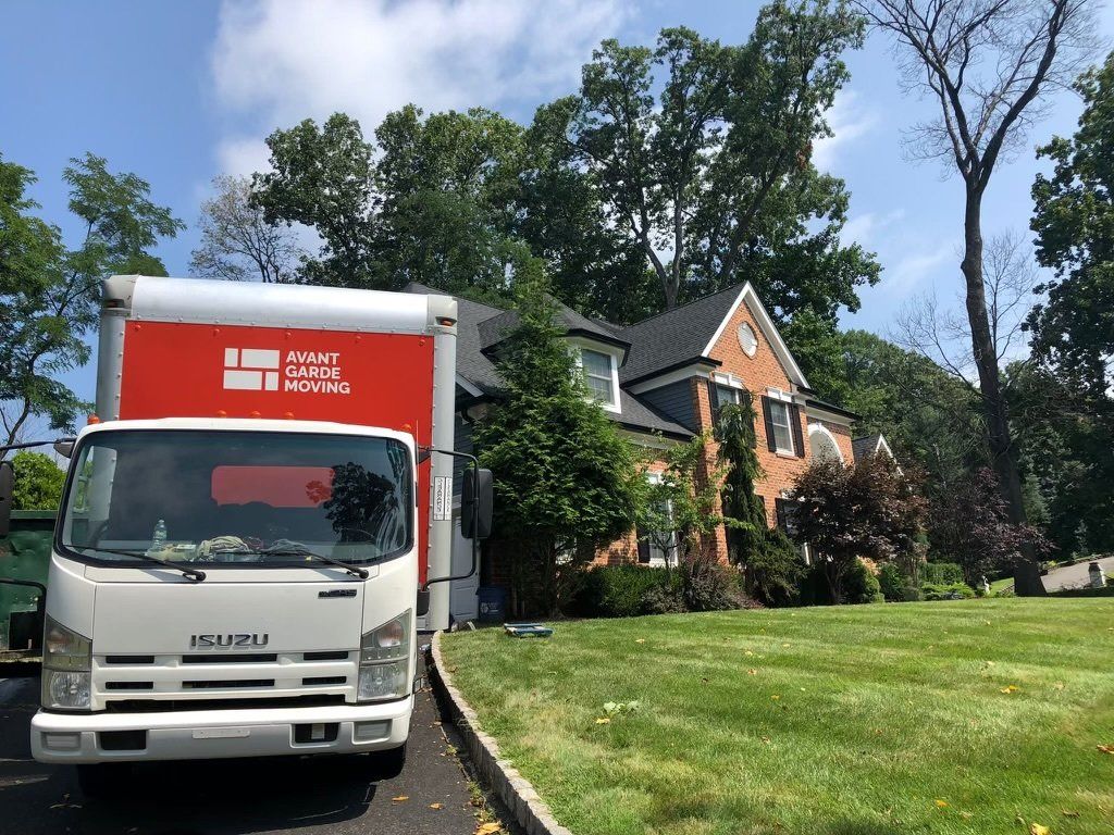 photo of avant-garde moving truck parked in front of the house in North Carolina