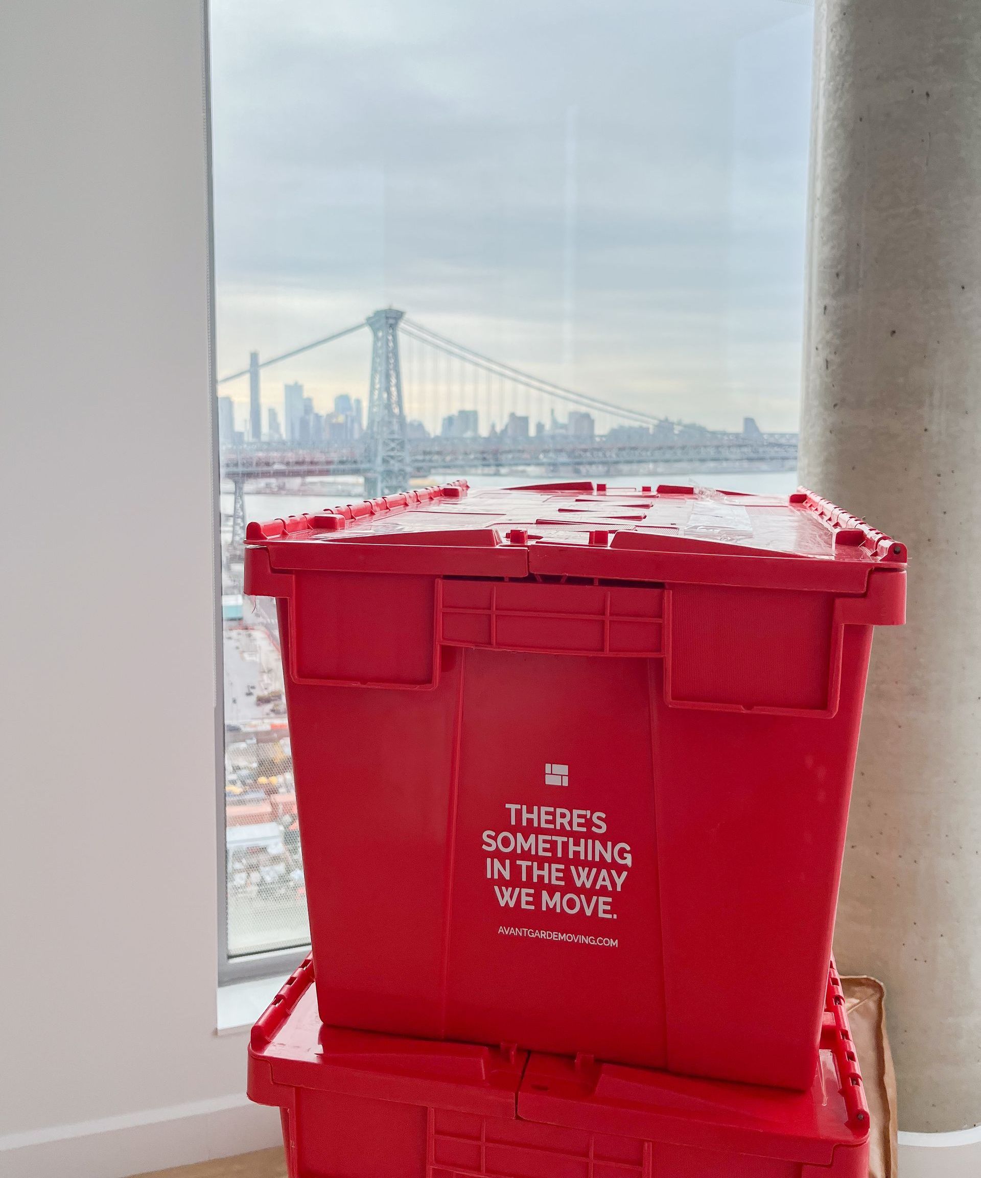 Our sturdy plastic moving bin with a stunning NYC cityscape backdrop, symbolizing professional pack