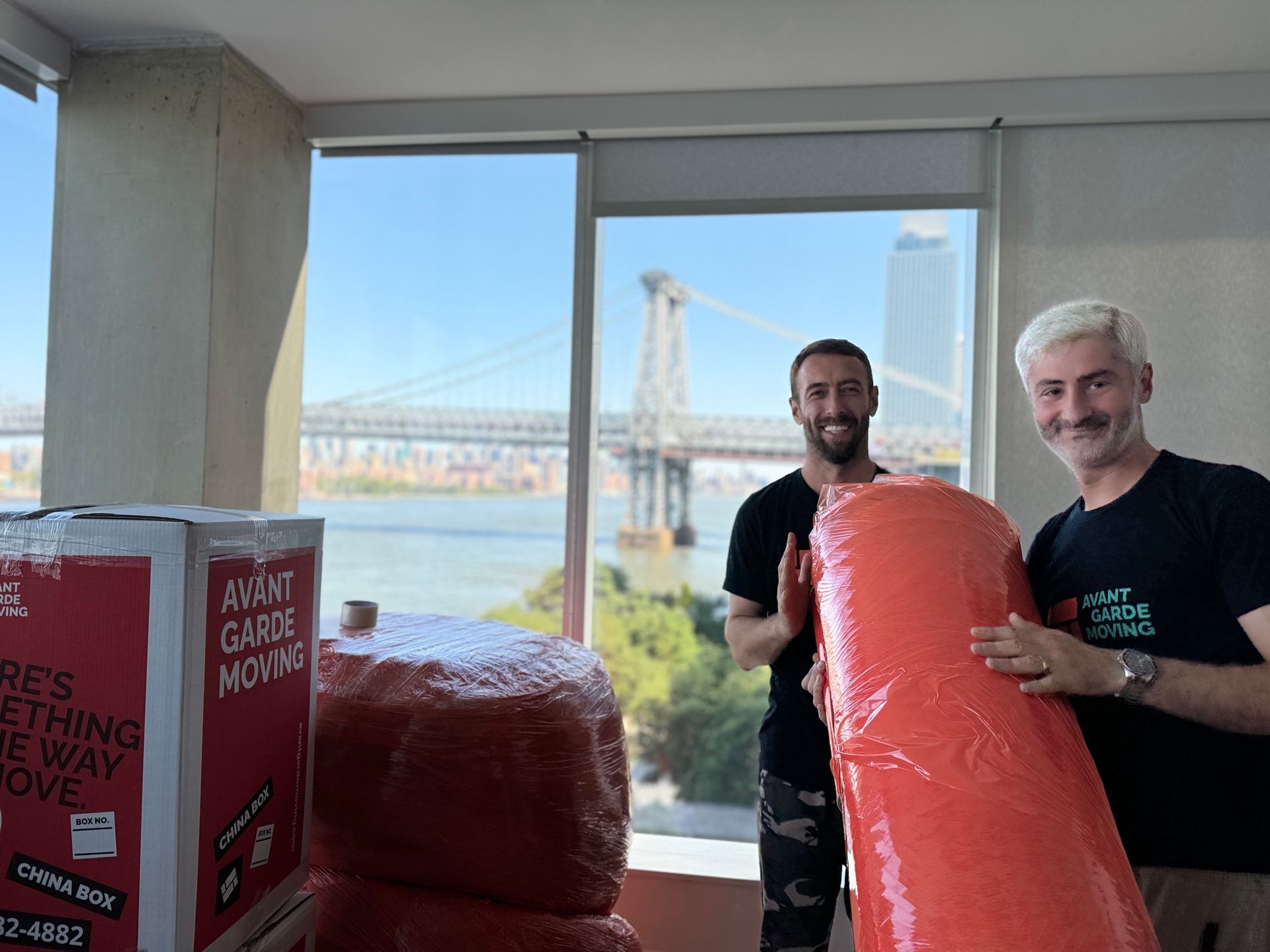 Photo of Avant-Garde movers wrapping and protecting the furniture in the customers house