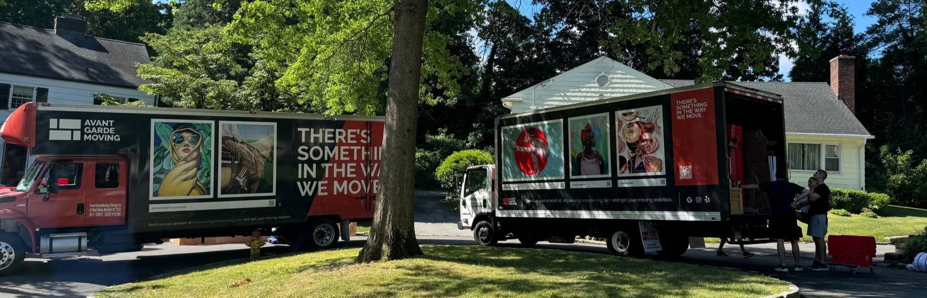 Photo of Avant-Garde movers unloading trucks in customers garage storage. 