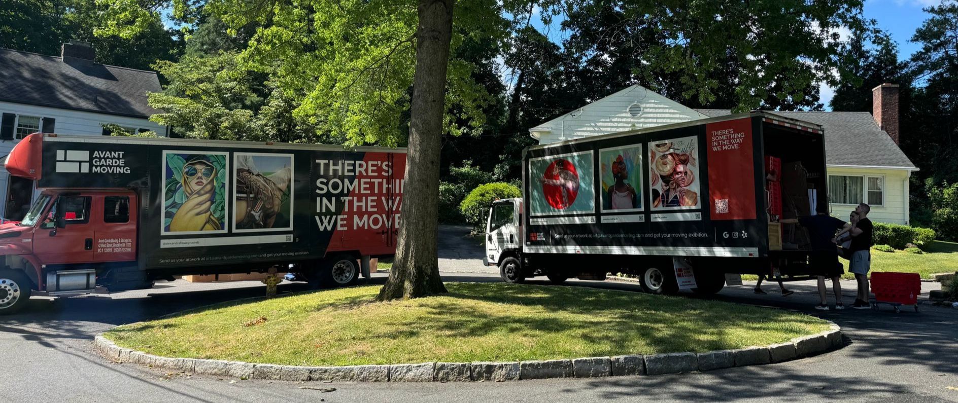 Avant-garde Moving trucks parked in front of the house in Scarsdale; getting ready for a move 