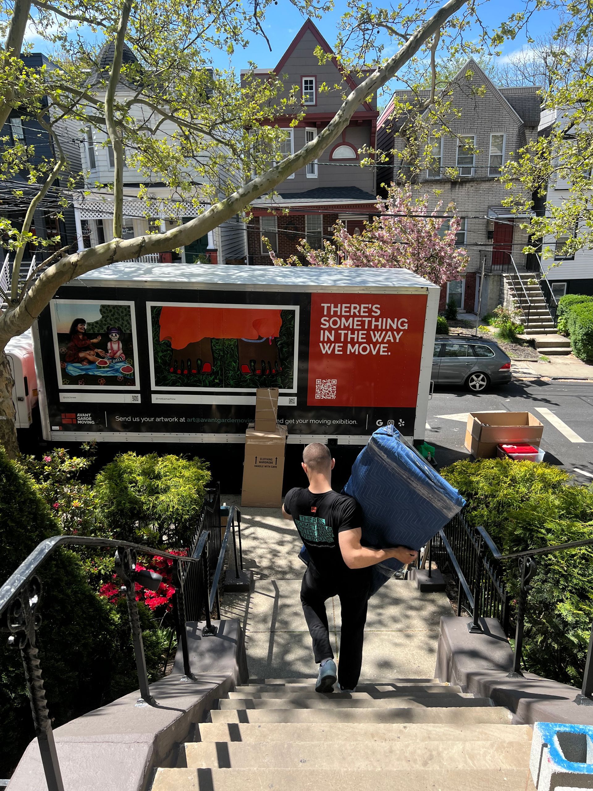 photo of a mover loading stuff in a truck 