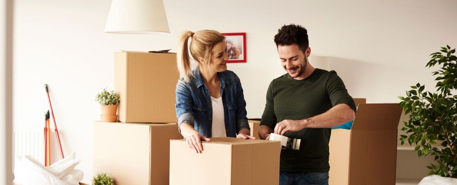 Moving team packing and labeling boxes