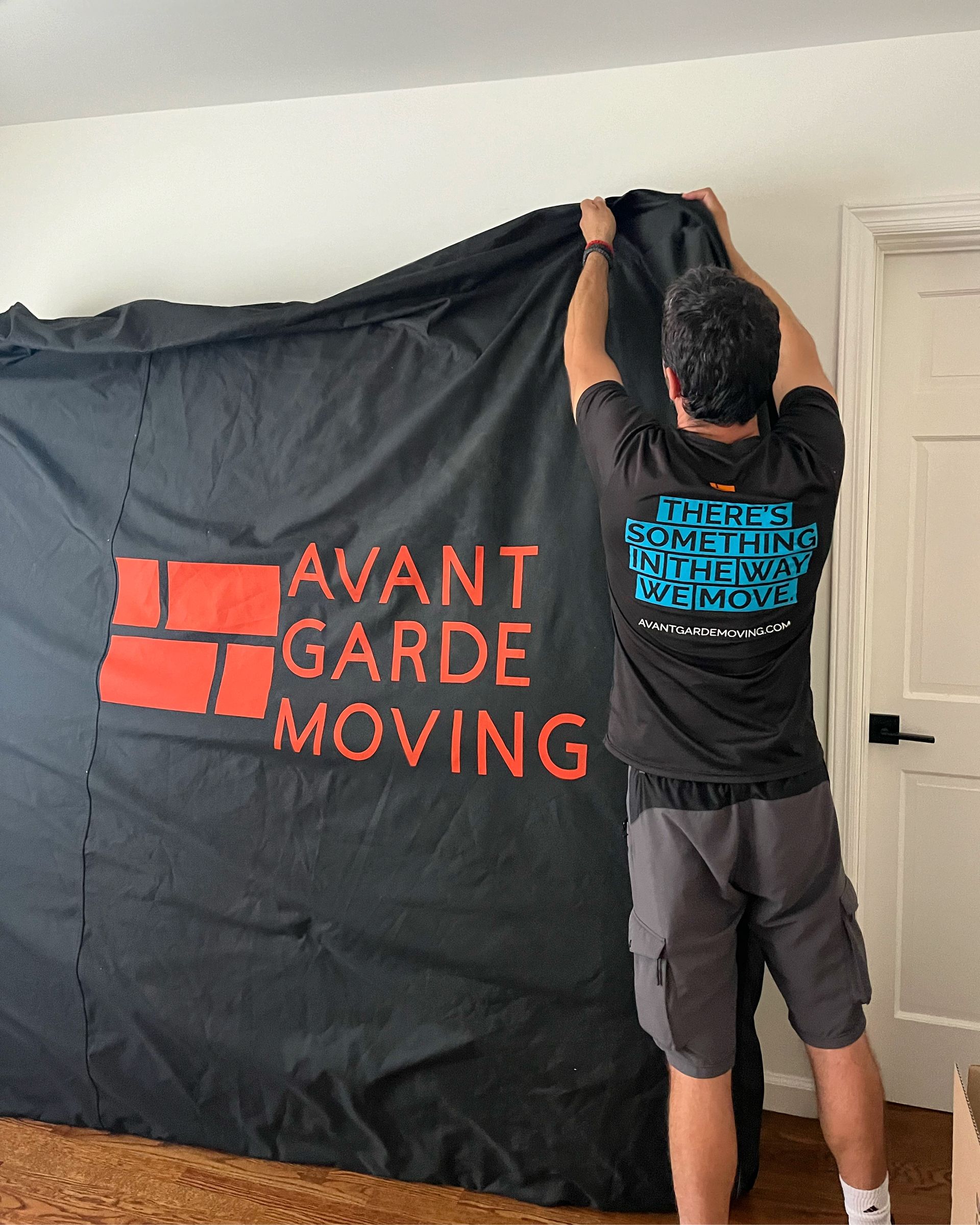 avant-garde mover closing up the mattress cover 