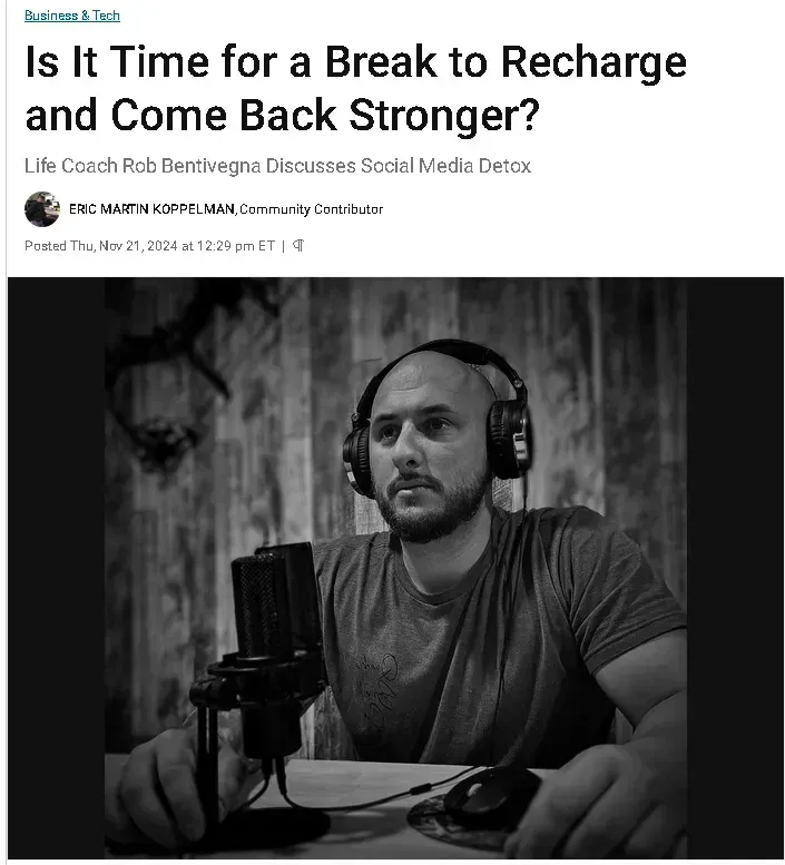 A man wearing headphones is sitting in front of a microphone ..