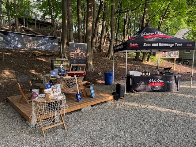 Guests at Pat’s Bar & Grill enjoying Whiskey & Cigar Night on the patio with fire pits, drinks, and a relaxed summer evening atmosphere.