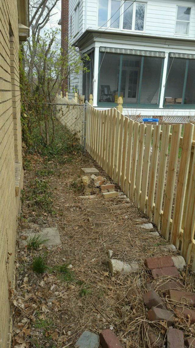 There Is A Wooden Fence In The Backyard Of A House – Mishawaka IN - Milestone Fence