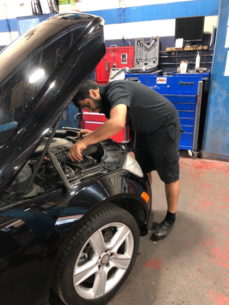 Car Repair — Man Repairing Car Engine in Chicago, IL