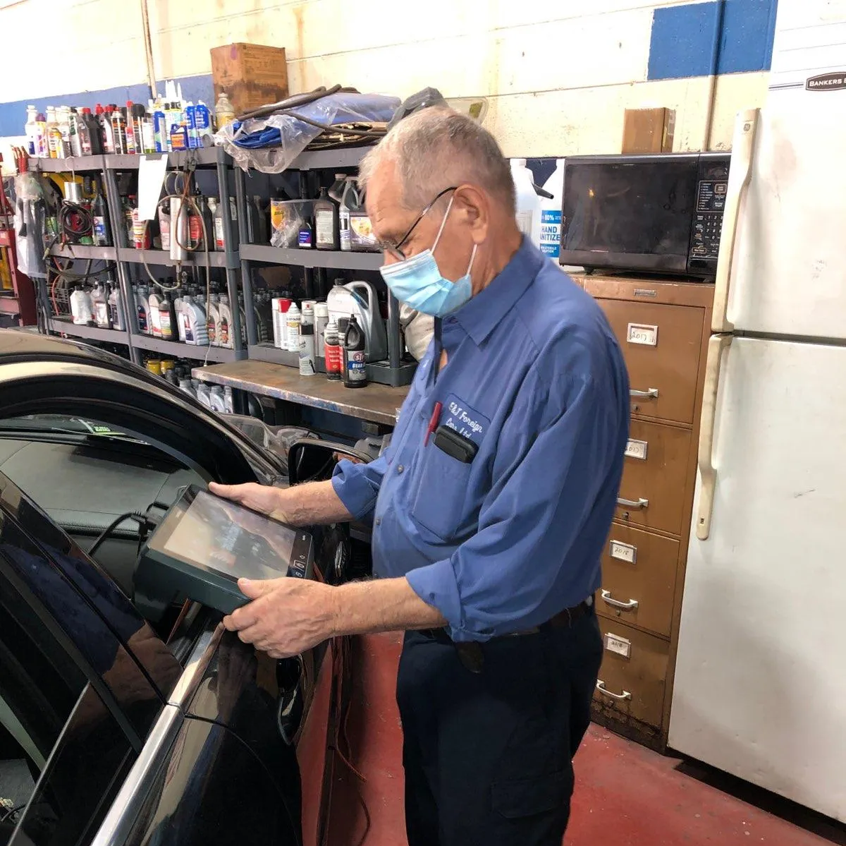 Car Transmission — Professional Man Doing Diagnostic on Car in Chicago, IL