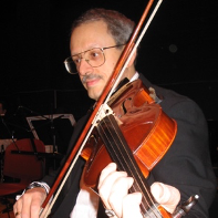 A man wearing glasses is playing a violin