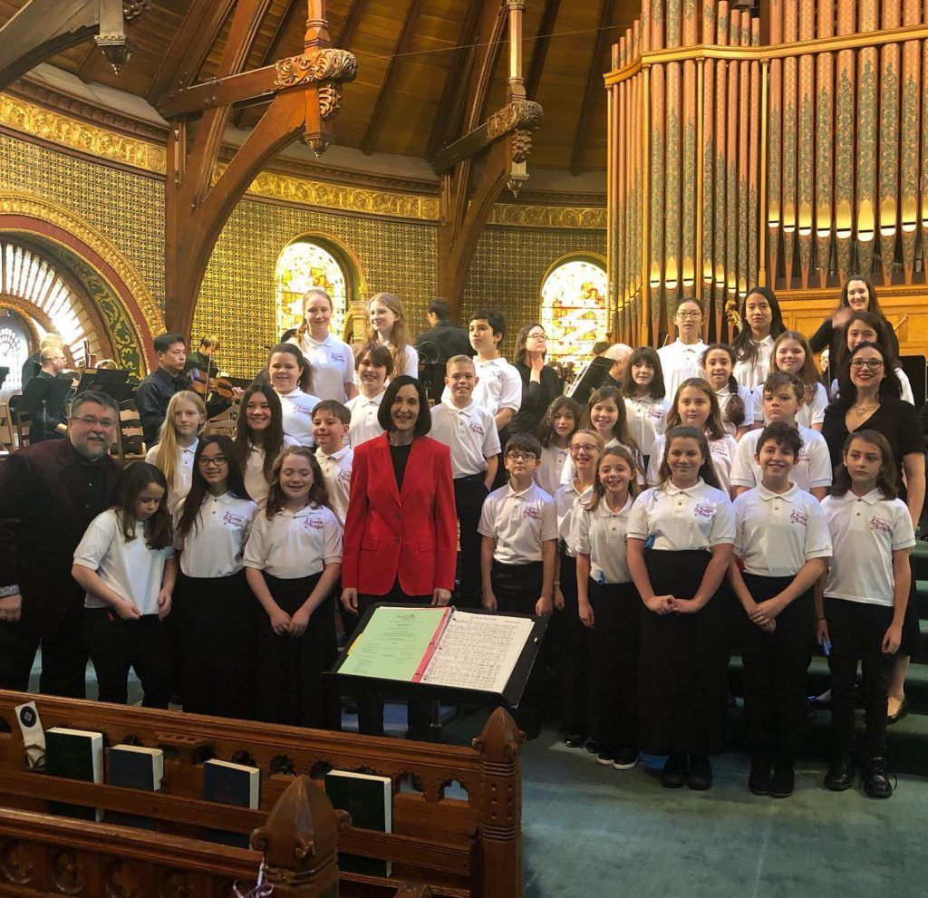 A group of people are posing for a picture in a church.