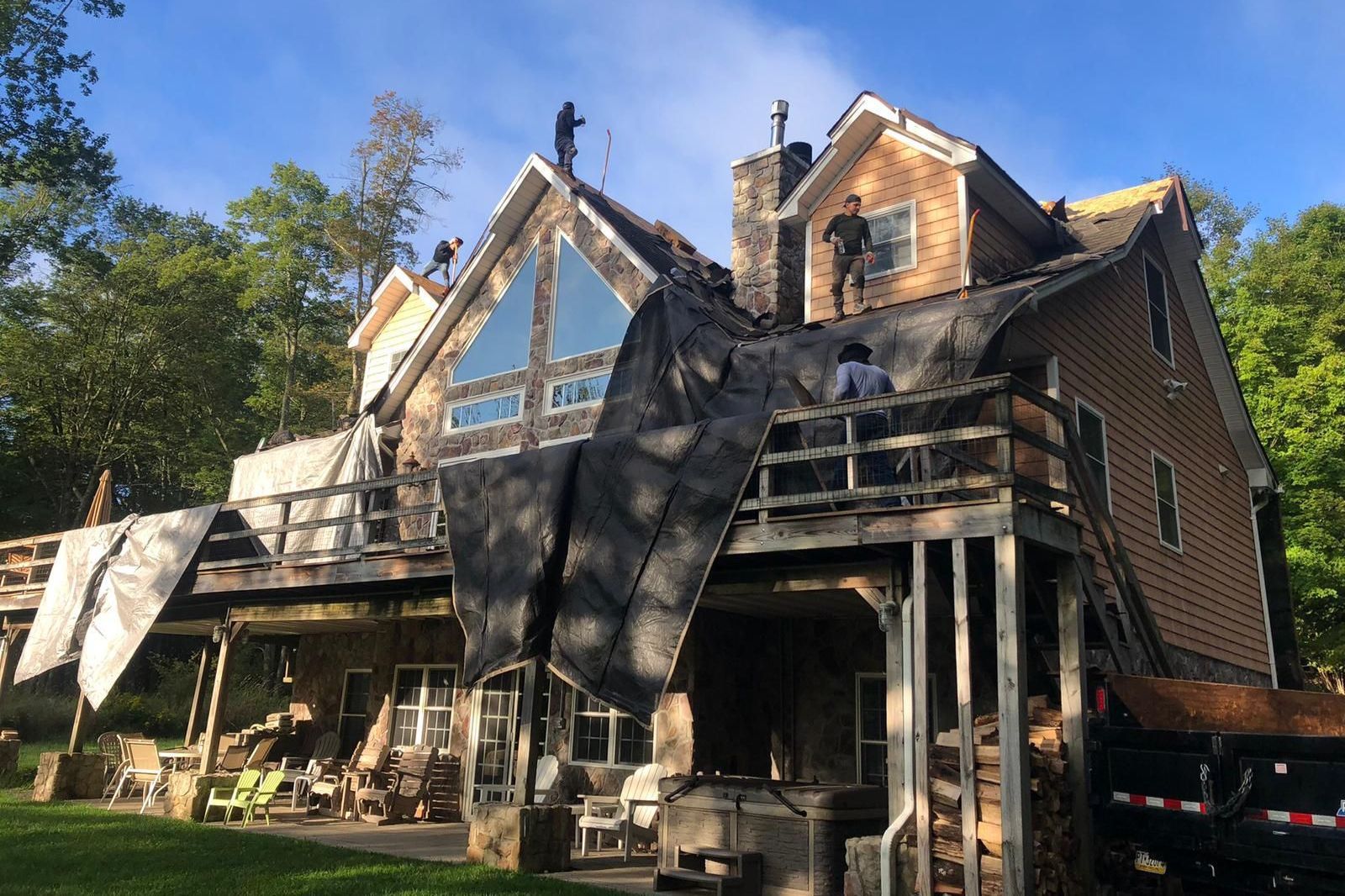 A large house with a lot of windows is being remodeled.