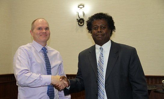 Dion, 5-years of service recognized employee (R) and the Director of IT Services