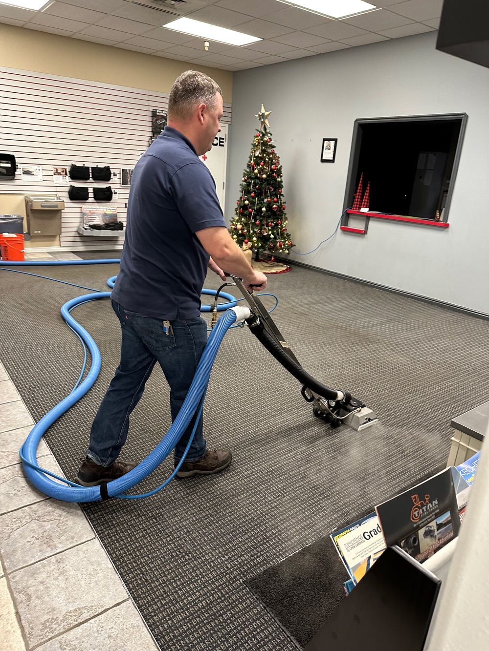 Man Cleaning The Carpet — Idaho Falls, ID — AAA Custodial Services