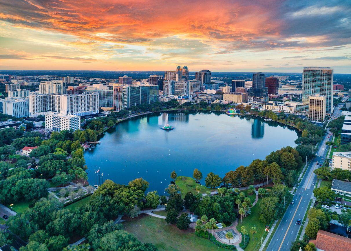 Aerial view of downtown Orlando, Florida at sunset with Lake Eola, and city skyline