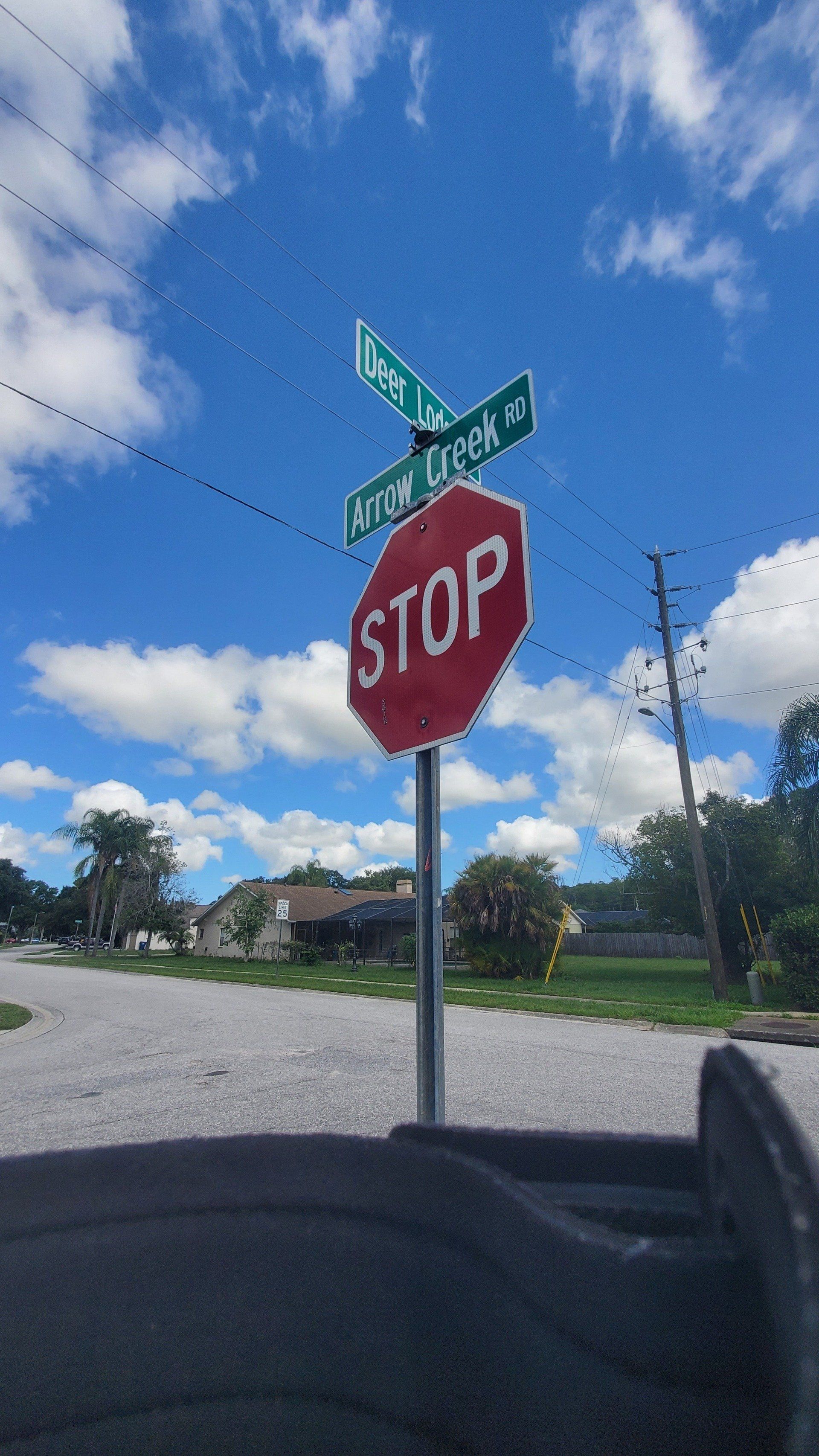 A stop sign is in the middle of a street