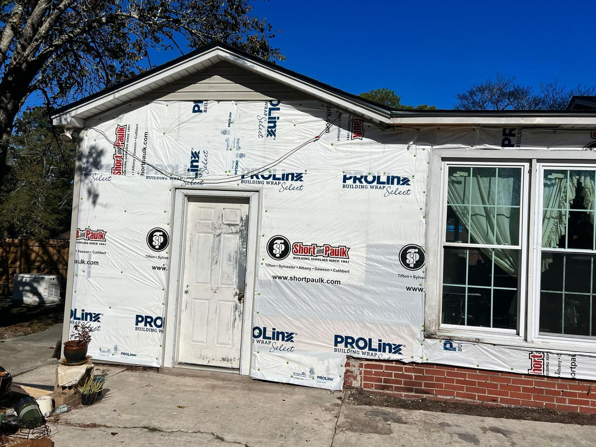 A house is being remodeled with a lot of paper on it.
