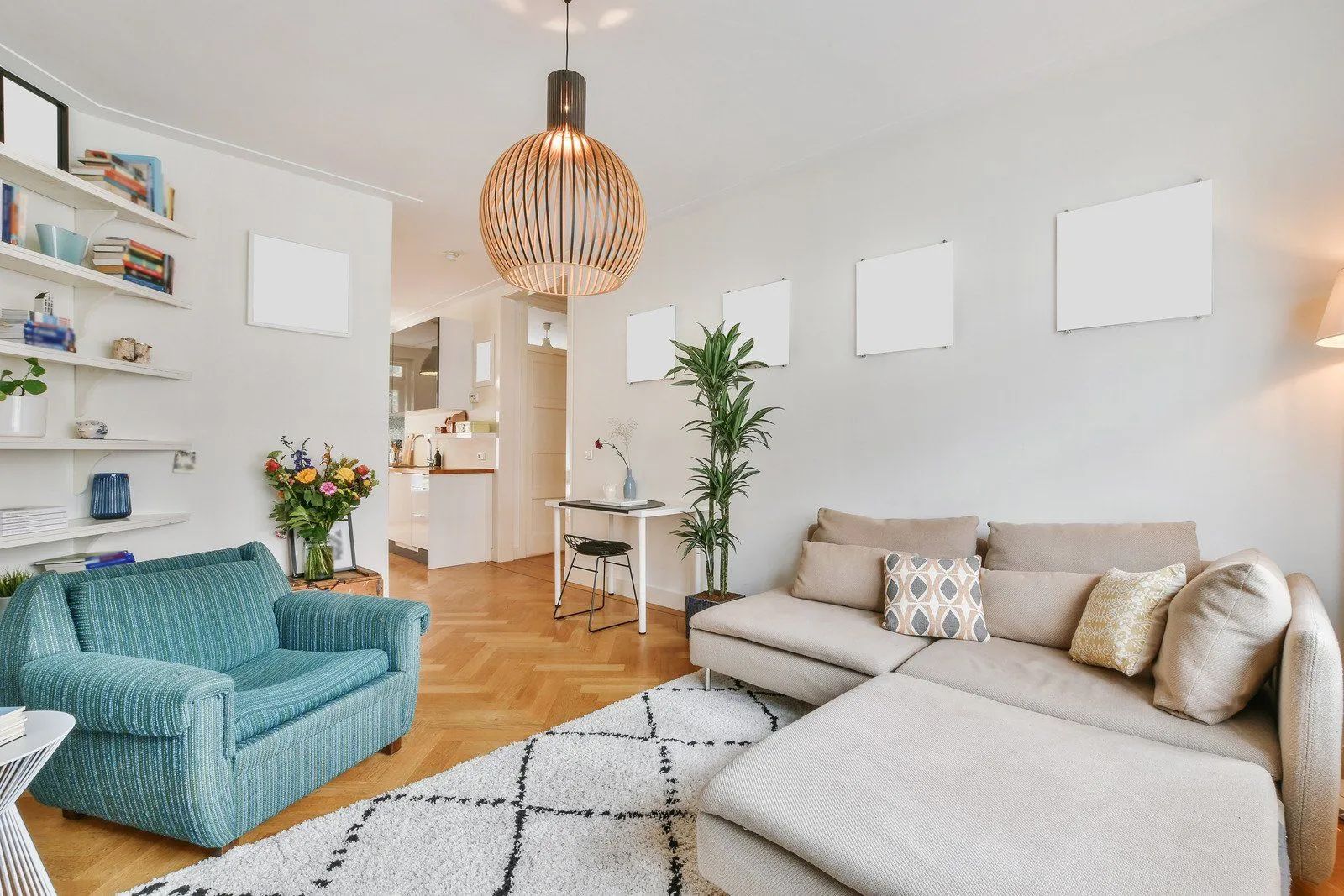 A living room with a couch , chair , ottoman and rug.