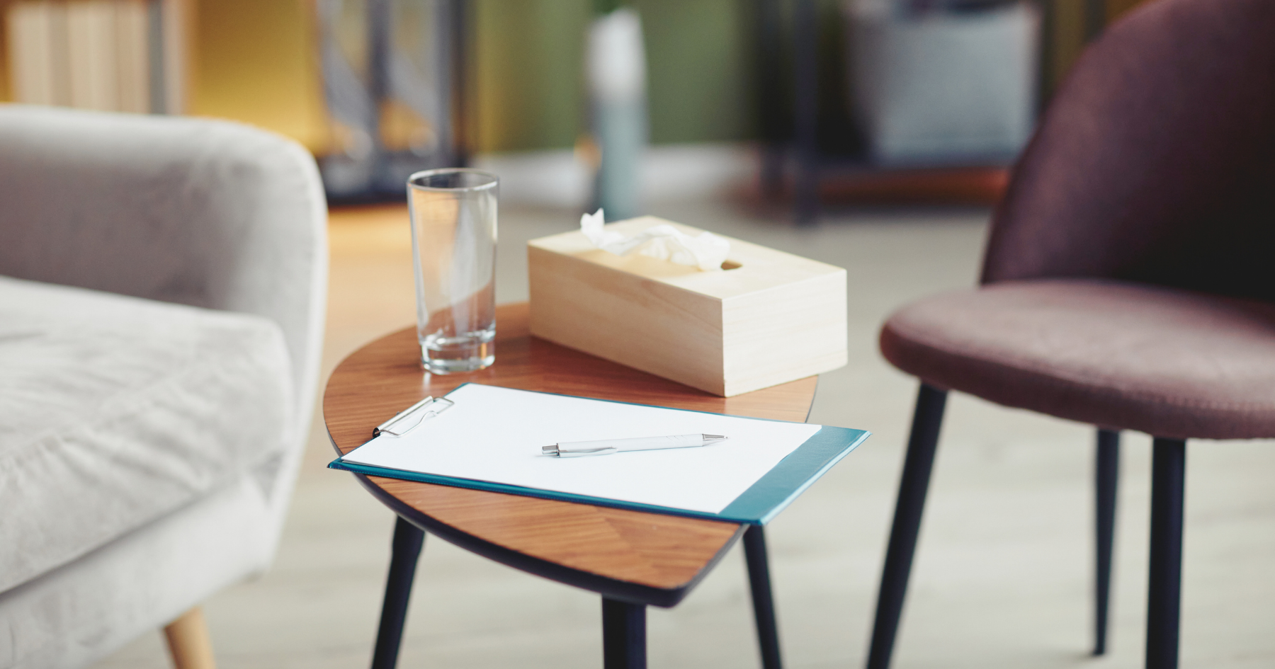 table with tissues and notepad, in the office of an eating disorder specialist