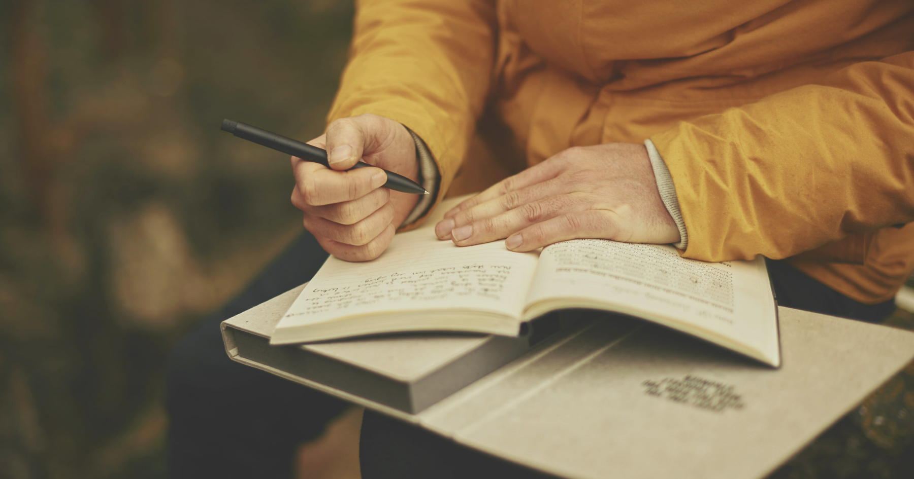 close up of a man hands as he journals - representing a highly sensitive person