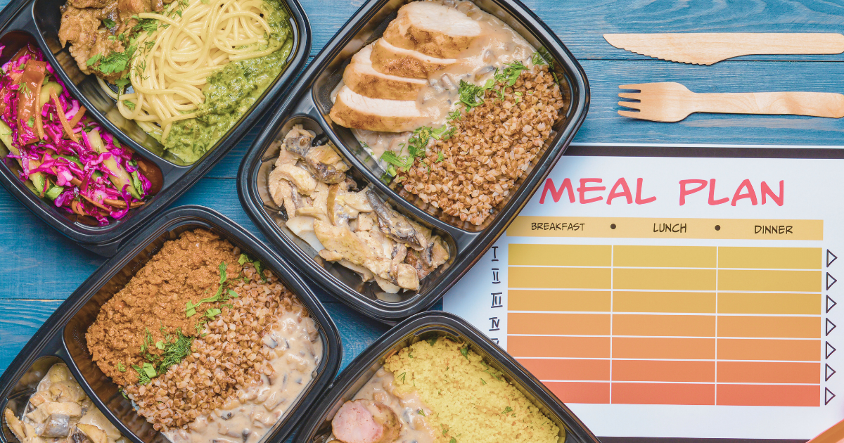 a meal plan chart and several containers of pre-portioned foods
