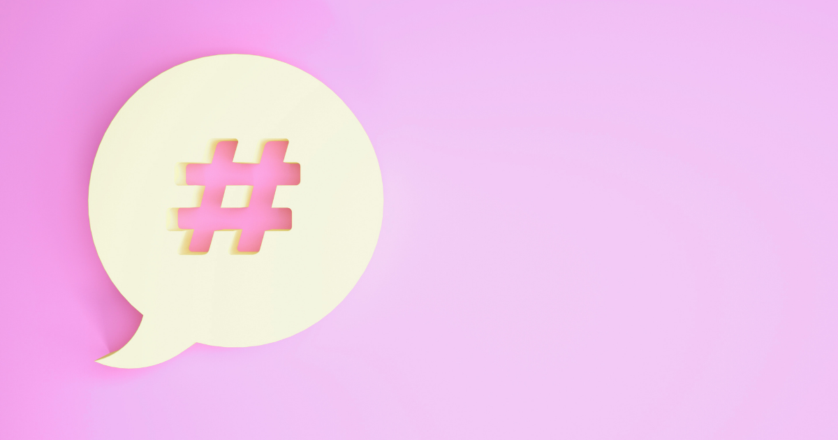 hashtag in a conversation bubble on a pink background