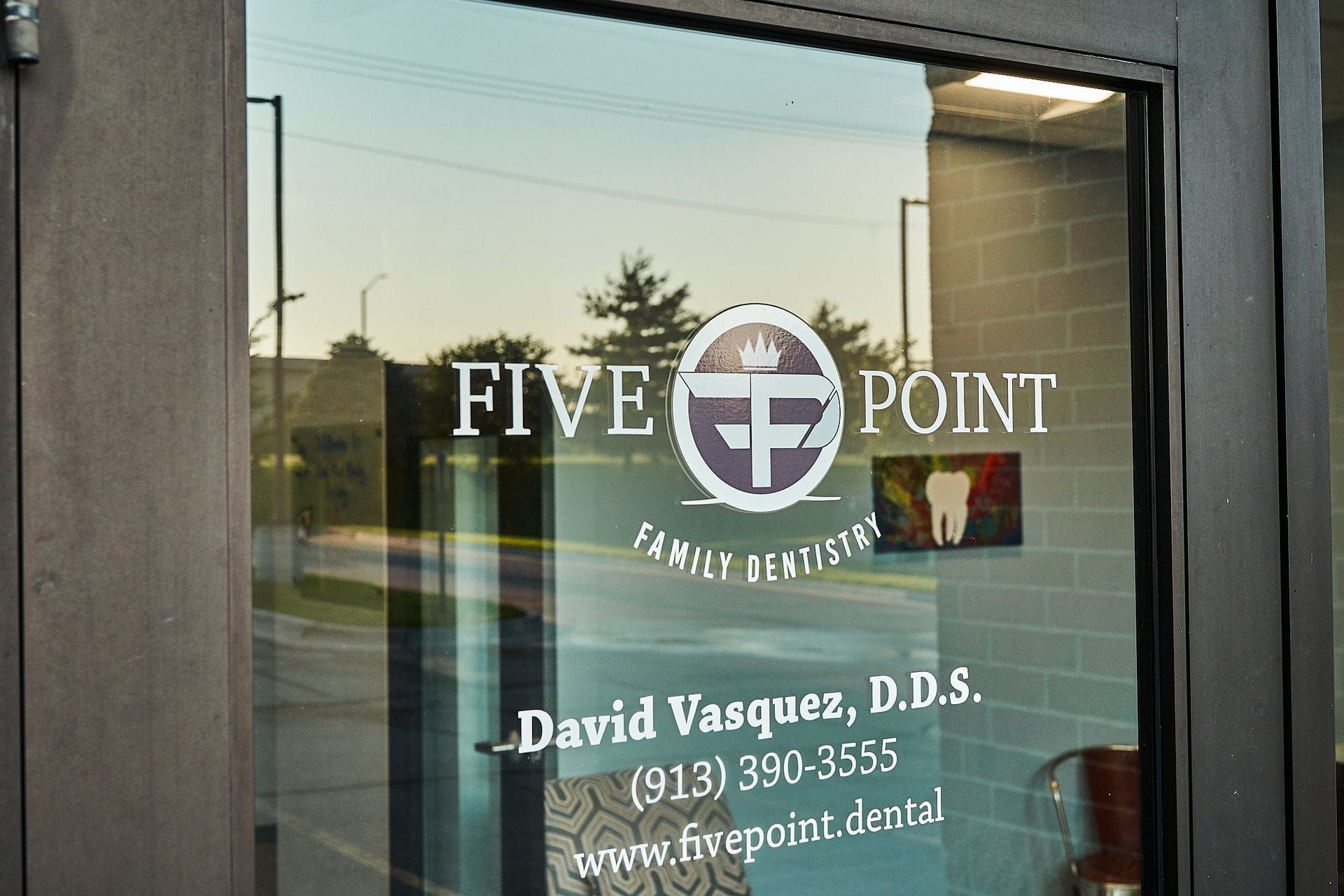 A glass door with the word five point on it