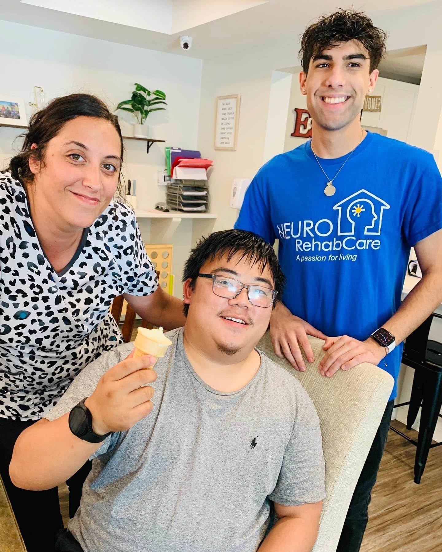 A group of people standing next to each other in a room.