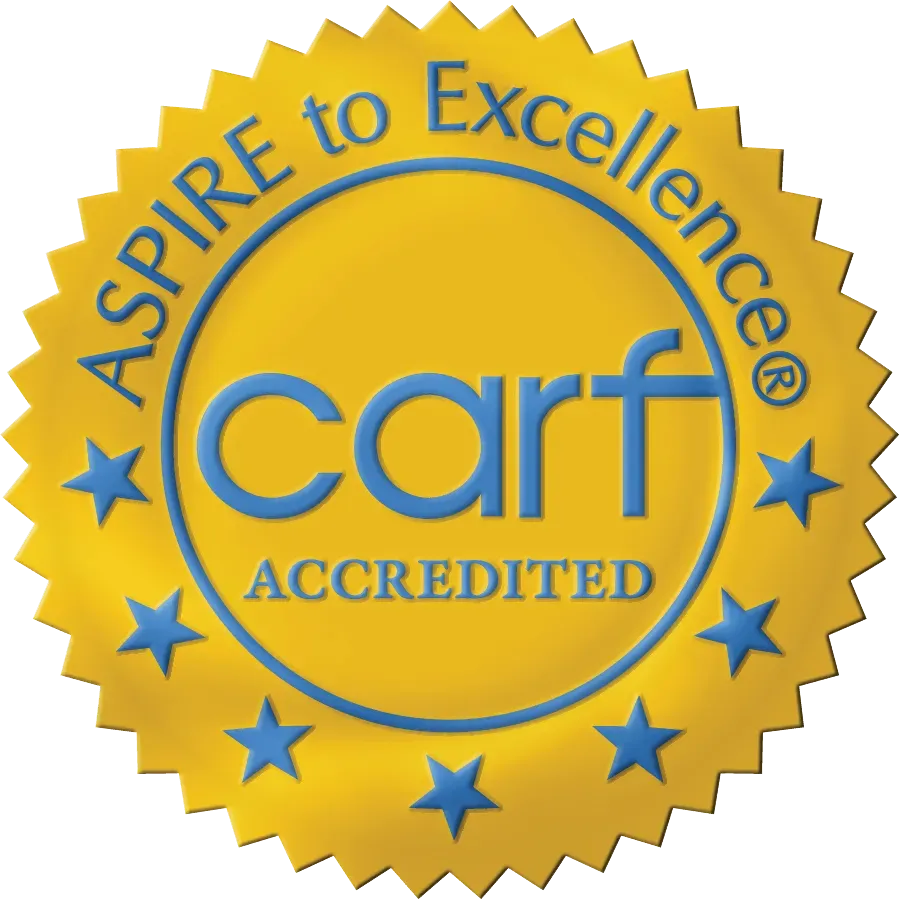 A seal that says aspire to excellence carf accredited