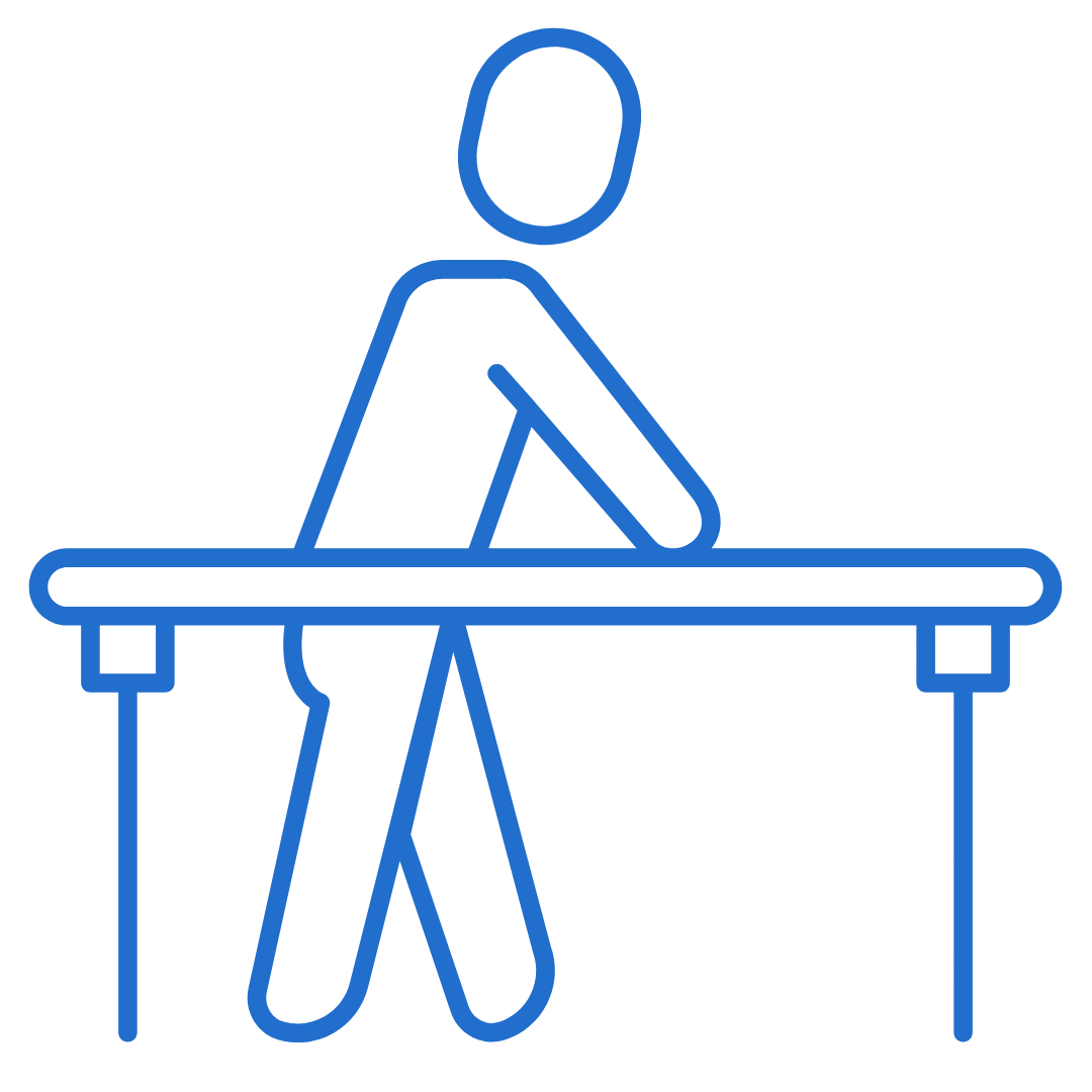 A person is sitting at a table with their legs crossed.