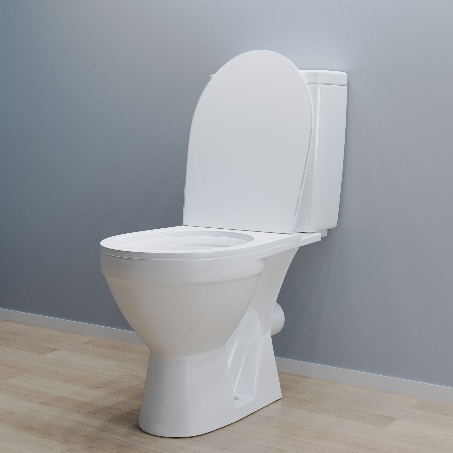 a white toilet is sitting in a bathroom next to a wall .