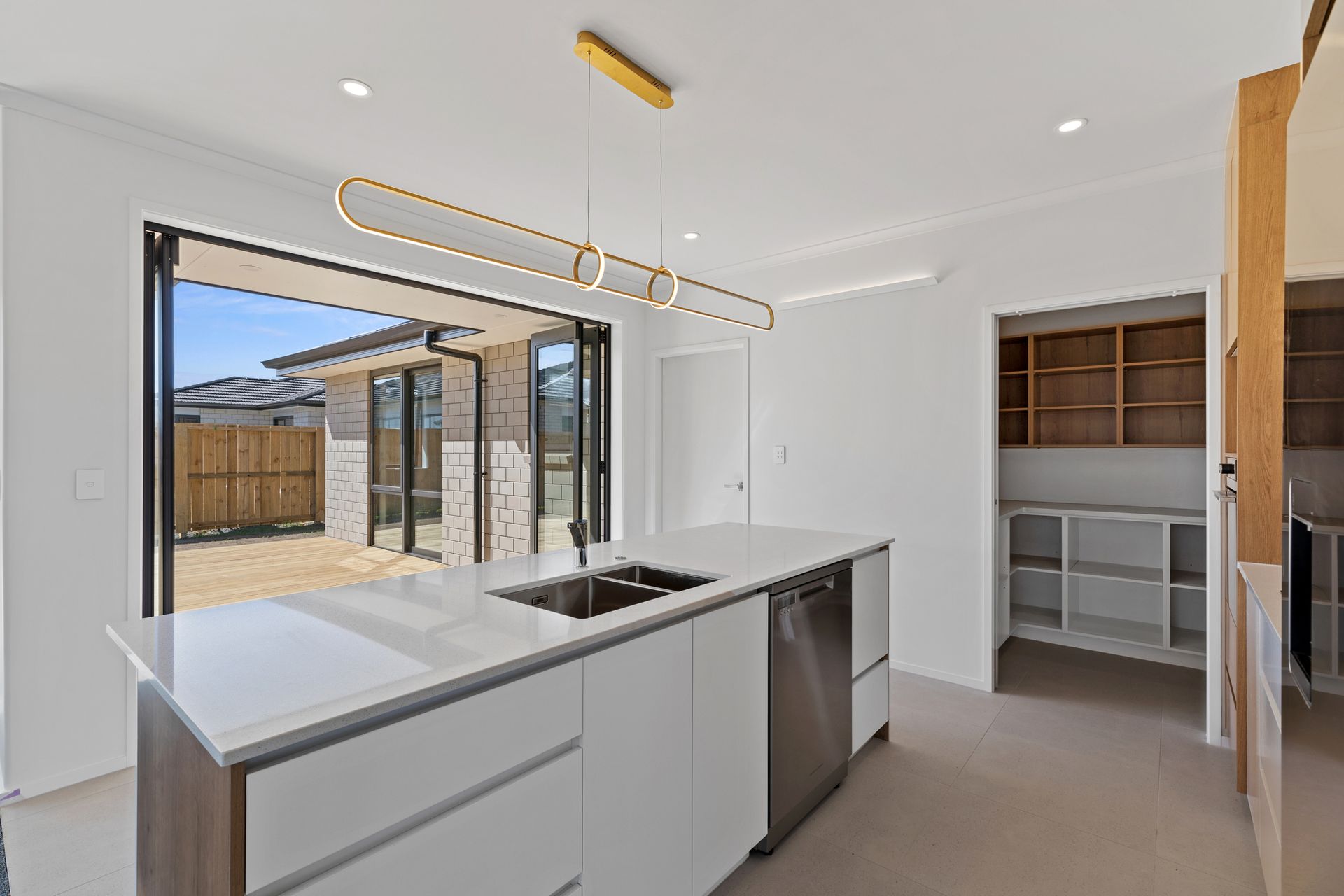 There is a large island in the middle of the kitchen.