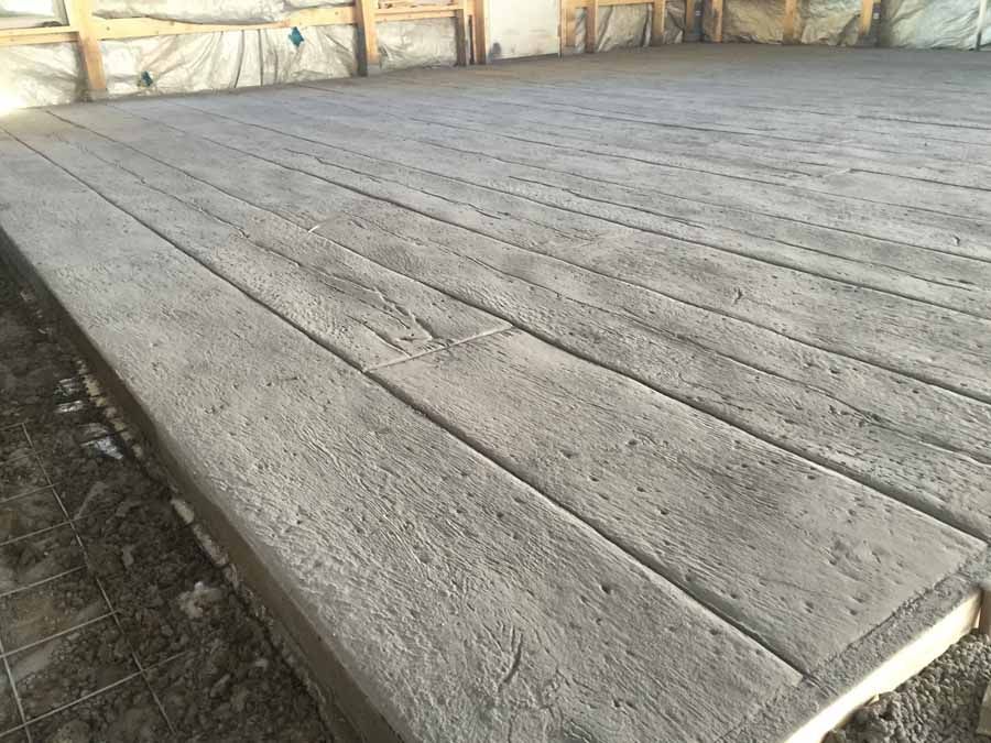 A concrete floor that looks like a wooden deck.