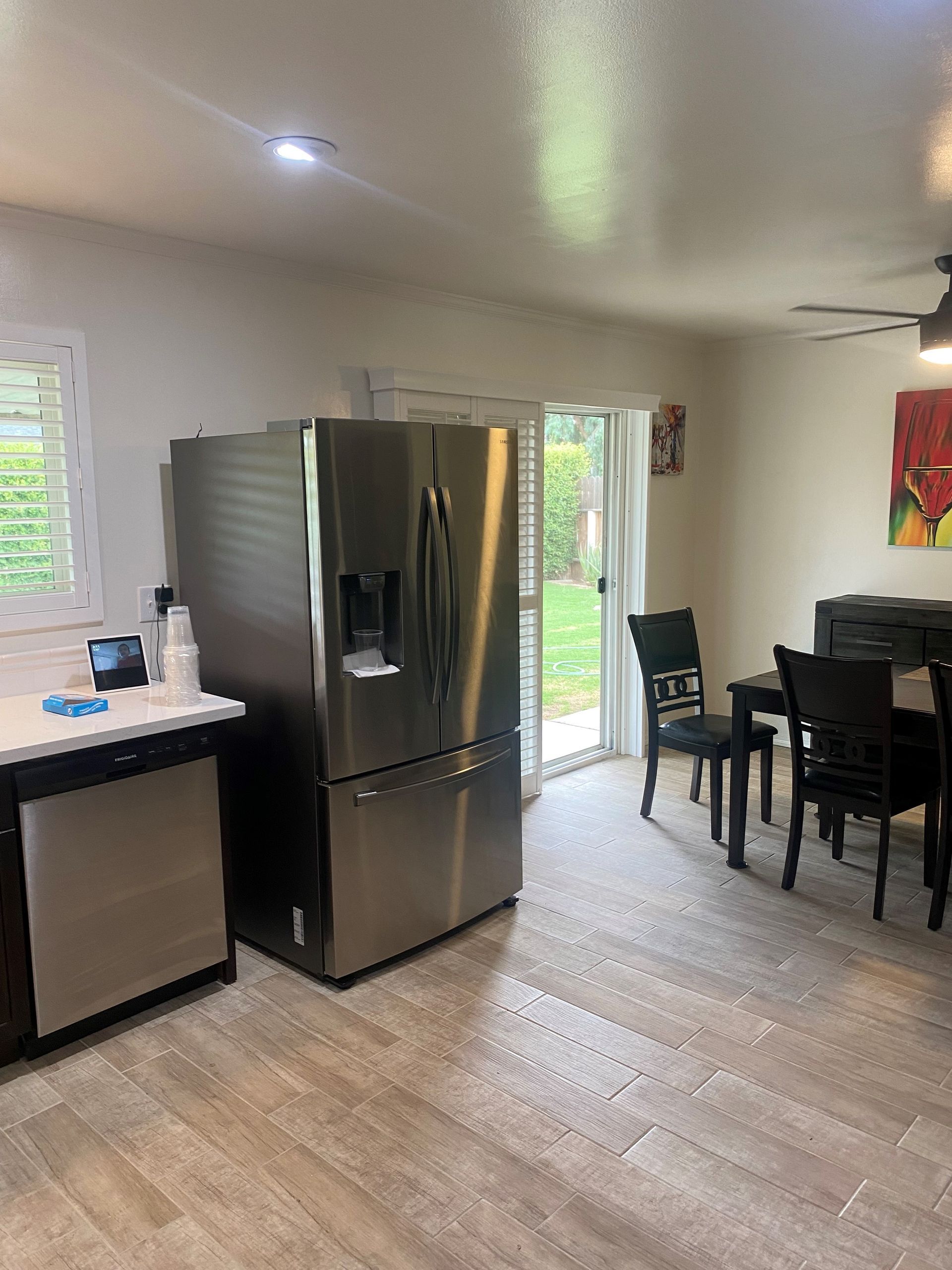 Full Kitchen With All Fridge Refrigerator And Dining Table — Bakersfield, CA — Pioneer Construction Company